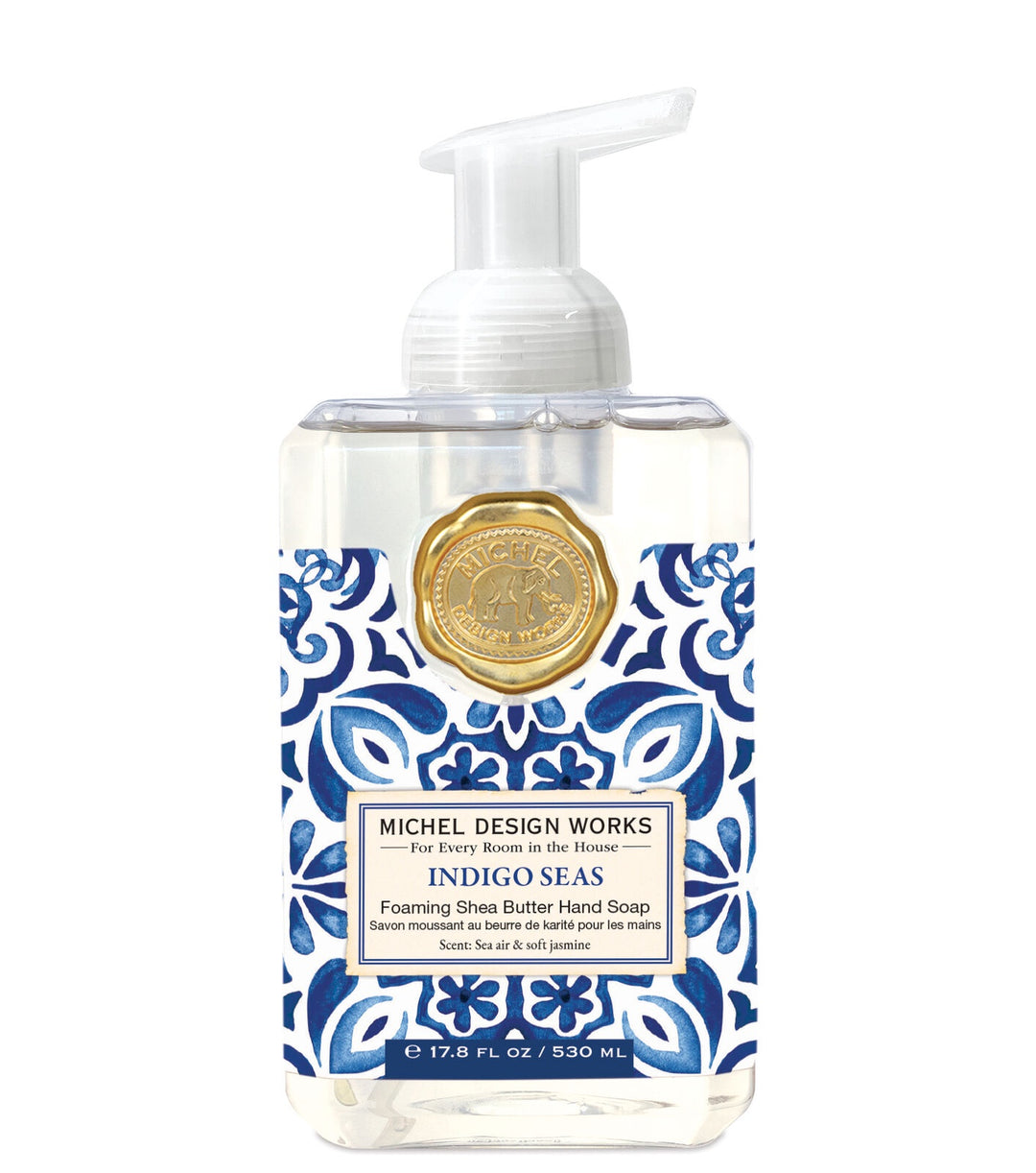 A pump bottle of Michel Design Works Indigo Seas foaming hand soap with a blue and white patterned label.